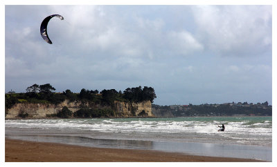 Kite-surfing along the beach