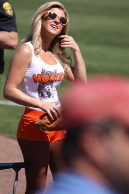 Hooters Girls serve as foul line ball girls during Spring Training games