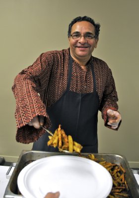 Prof Bhushan serving food at Indian Night _DSC7219.jpg