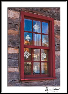 Old Salem Window with Cut Paper Snowflakes
