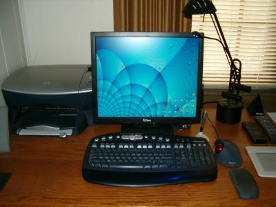 My desk with my artwork on the screen.