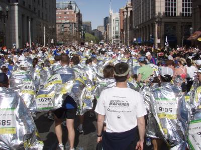 Walking to chip removal stations after end of marathon
