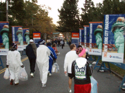 Walking from bus drop-off point to the athlete's village