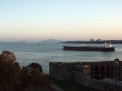 Distant view of Manhattan at sunrise (Ft. Wadsworth in foreground)