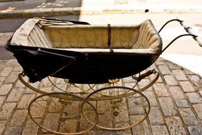 antique carriage on sidewalk