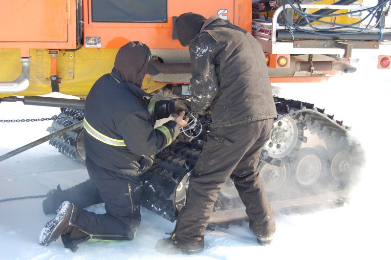 Mechanics working on Sno-cat