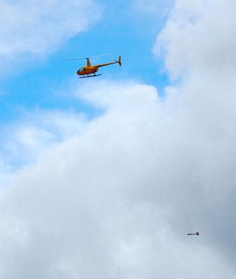 Robinson R44 F-OPRM with heli-mag bird in flight over New Caledonia