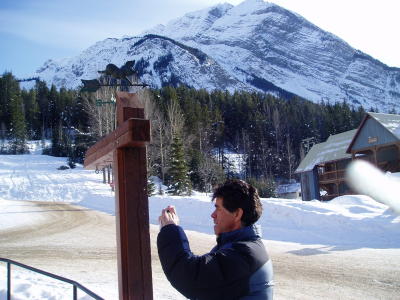 Henry in Field taking a picture of a post