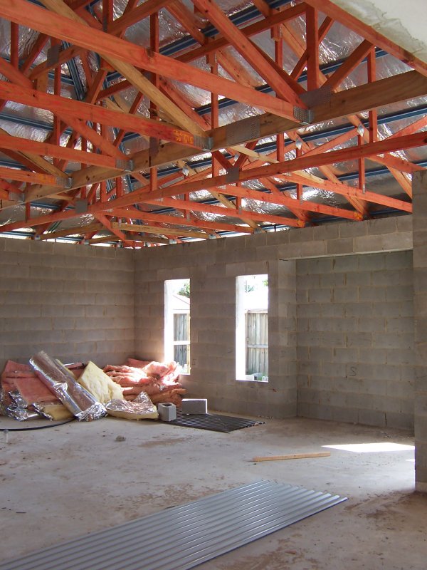 Roof cladding going on.