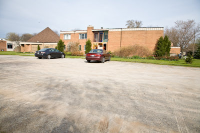 The congested parking lot at the diocesan service.