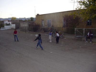 Kids playing soccer infront of Reynaldo Quezadas home