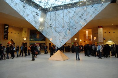 Bright and early the next morning at the entrance to the Louvre, beneath the pyramid.