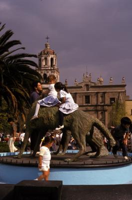 Kids Playing on Cayote Statute in Coyoacan