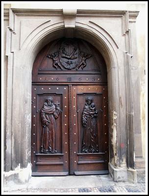 Carved wooden door to Monastary near Old Town Square