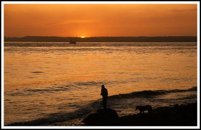 Sunset and fisherman