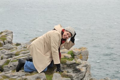 Glynda looking over the cliff at  Dun Aengus