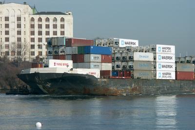 Columbia Baltimore, barge with containers, exiting