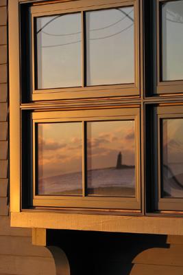 Whaleback Light, reflecting in window at dawn