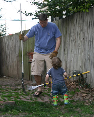 No Dad, you use two hands to hold the rake!