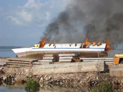 Customs burning illegals boats