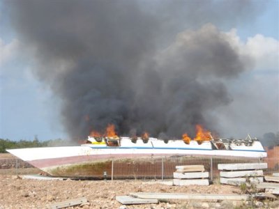 Customs burning illegals boats