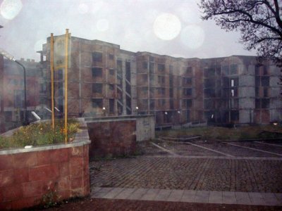 Wood smoke and drizzle, partly completed building, just run out of money and thats itJPG