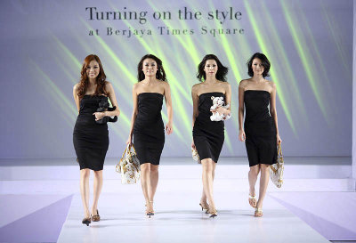 KUALA LUMPUR - JULY 01: Models walk down the run walk in a fashion show Turning on the style presented by Berjaya Times Square