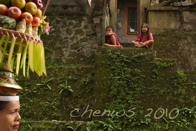 Children watched from the homes as the procession went through the village _MG_2134.jpg
