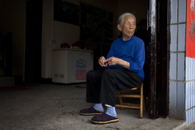 Elderly lady at her home.