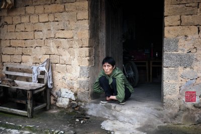 Resting at the doorstop, village in Xingping.