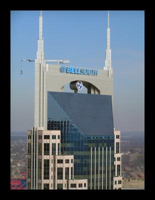 Close up of the Bellsouth Tower crown.  That's the window washer hanging from the bucket!