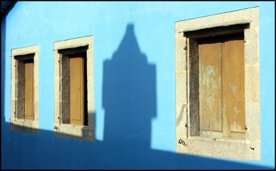 Three windows and a shadow