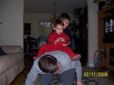 Evan and Ben get a horsey ride from Papa