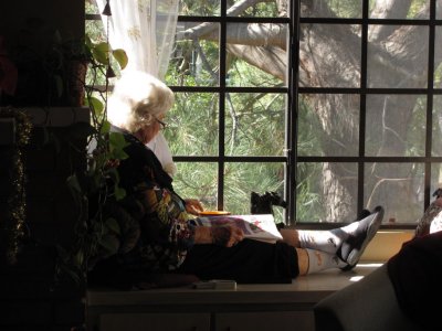 Mom sitting in the sunny window seat