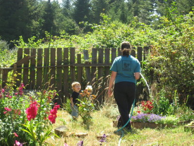 Arwen & Dylan watering the garden