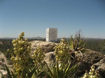 Marker on top of hill with ranch ridge in background