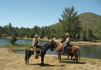 Cowboys in front of the lake