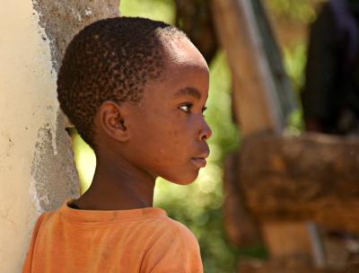 young boy in orange shirt