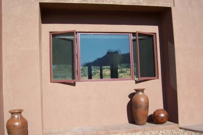 Kitchen window to the left of our front door