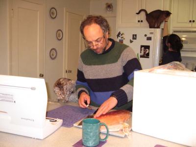 Our friend Carl Safina filleting salmon for dinner while Billy watches