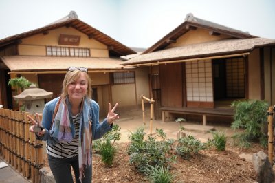 A reconstructed japanese village with a would be geisha.