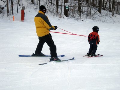 And That's James, Pulling His Dad Down the Slope :-)