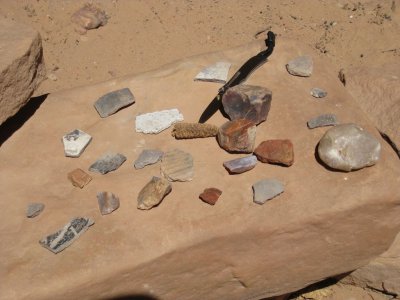 Potsherds at Junction Ruin...Note Corncob at Knife Point