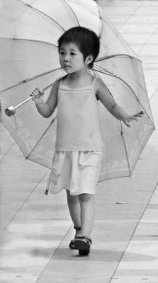 (3rd) Little girl, big umbrellaby arbitrary