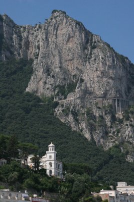 the narrow road on the rock is where bus goes from Capri to Anacapri