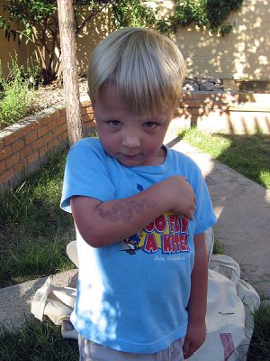The junior herpetologist shows off snake tattoo from Rattlesnake Museum