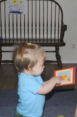 She reads her birthday cards