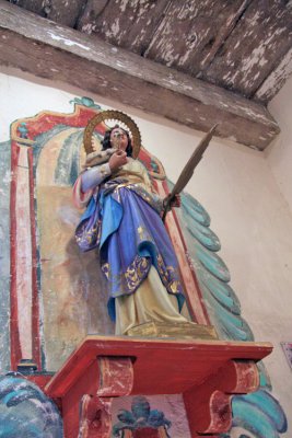 Statue of Saint Agnes on gift shop wall