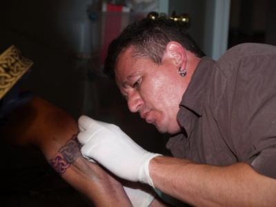 Tattoist at work by george_online