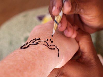 Painting with henna by Geophoto